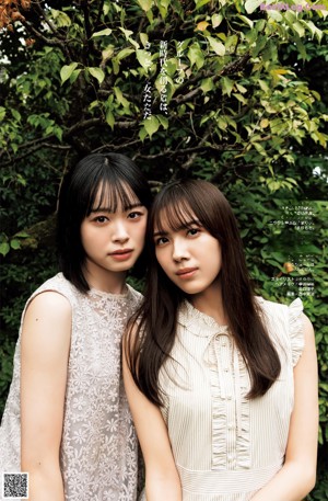 A couple of young women standing next to each other.