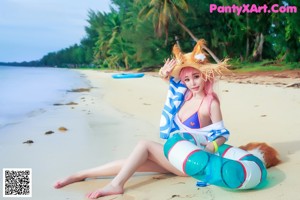 A woman in a bikini and a straw hat posing for a magazine.