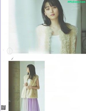 a magazine with a picture of a woman in a white shirt